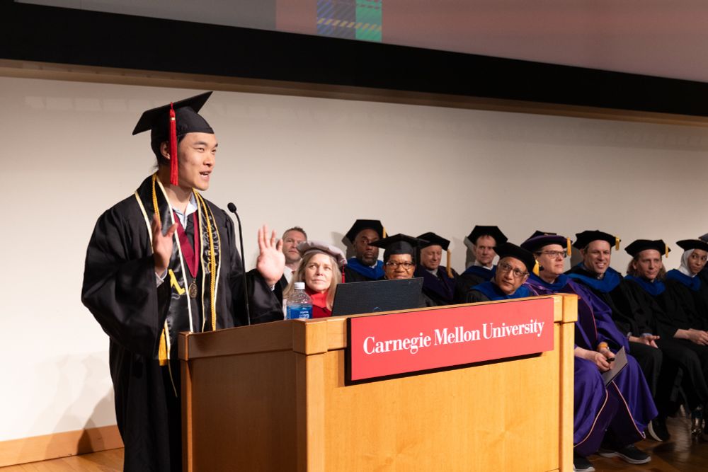 A student gives a speech during the Mathematical Sciences graduation ceremony.