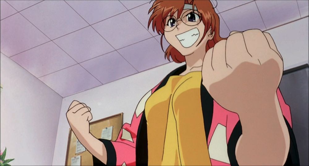 Hikaru Amano striking a determined pose with a huge grin