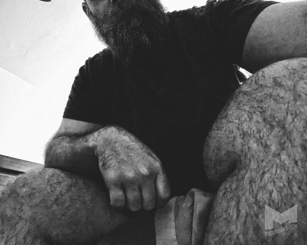 Pov angle of mads sitting on the edge of a bed in short shorts 