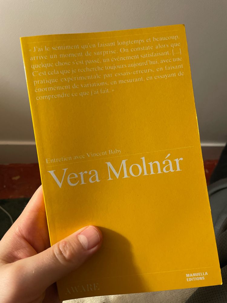 A yellow book about conversations with Vera Molnar and Vincent Baby around her practice in generative art
