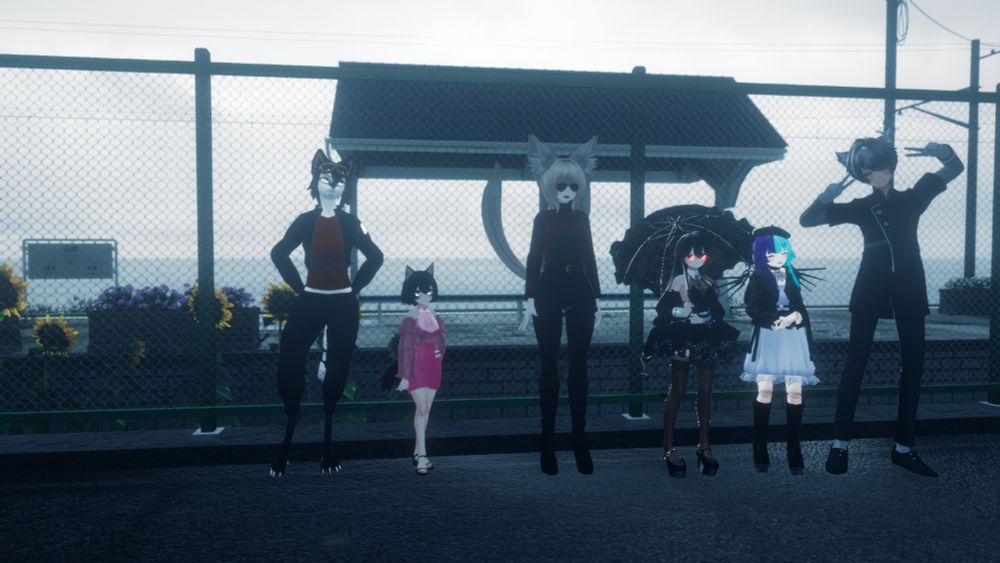 A VRChat group photo. 6 people pose in a row along a train platform fence.
