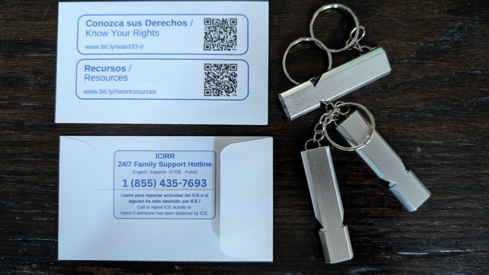 Envelope with a hotline and resources printed on it with a whistle inside