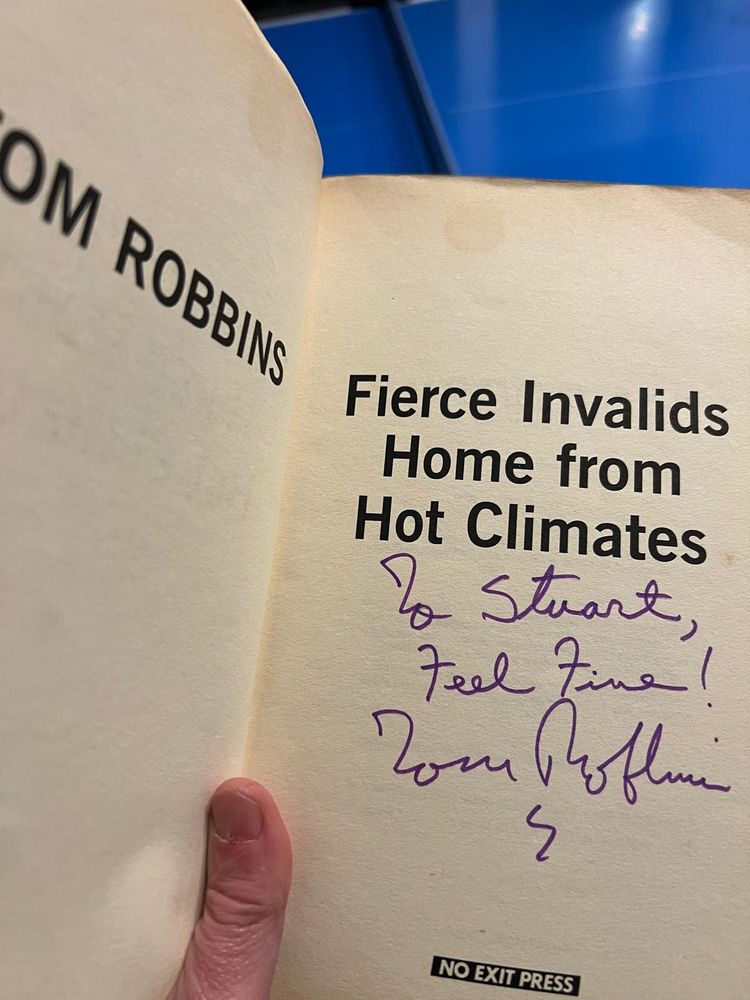 Signed copy of Tom Robbin's novel Fierce Invalids Home From Hot Climates. Inscription reads To Stuart, Feel Fine! Tom Robbins