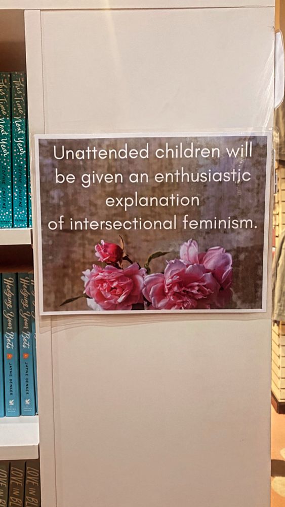 Sign in a bookstore that reads "unattended children will be given an enthusiastic explanation of intersectional feminism."