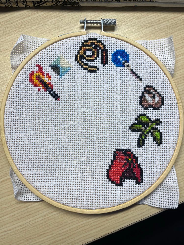 More detailed cross stitch pattern using Vampire Survivors icons 