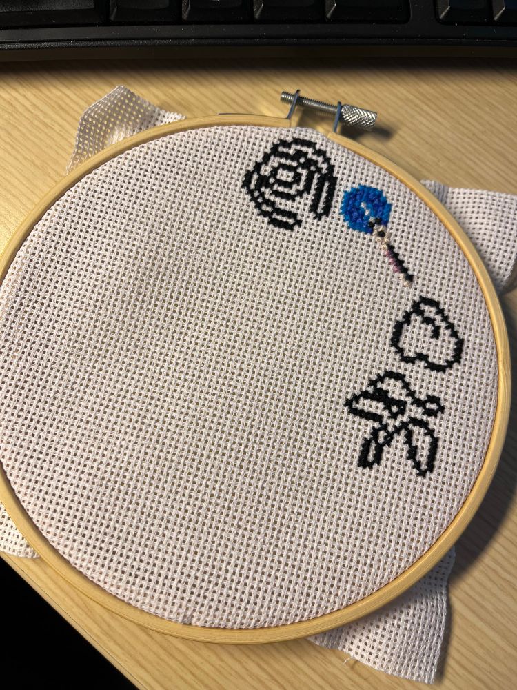 Early cross stitch pattern using Vampire Survivors icons