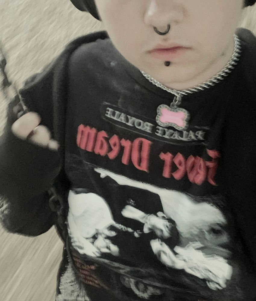 semi-faceless selfie of Bat cropped just below its eyes. He is on a fast moving swing while taking the photo.