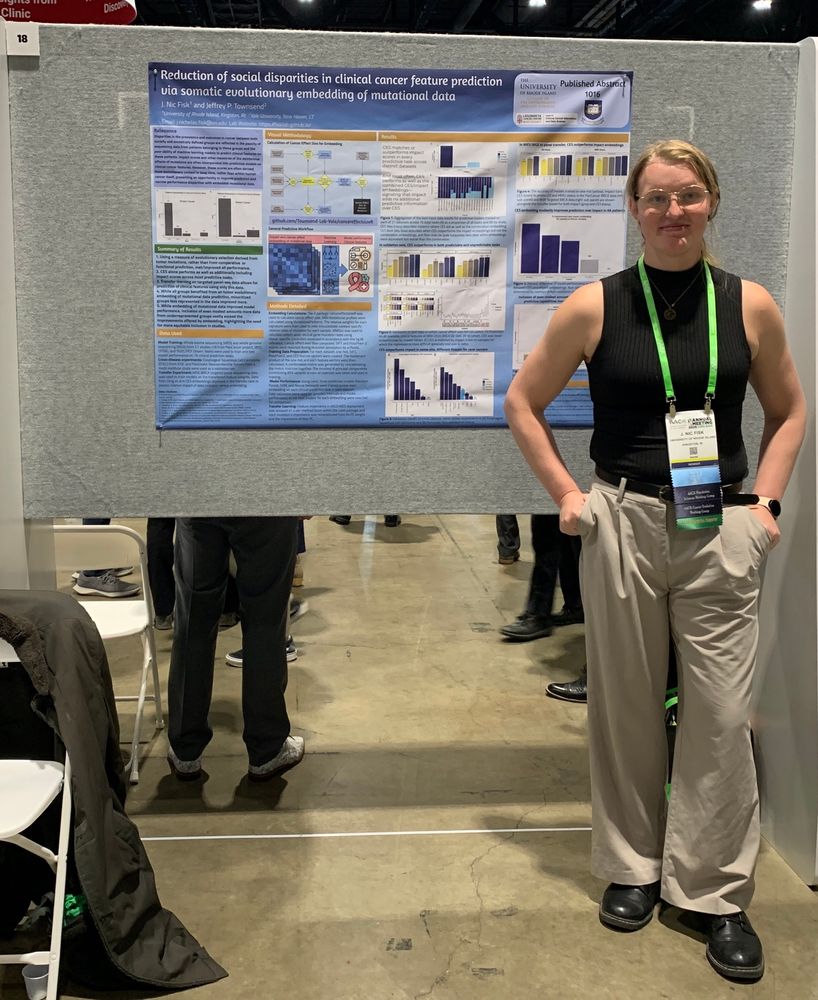 Prof Nic Fisk in front of a scientific poster