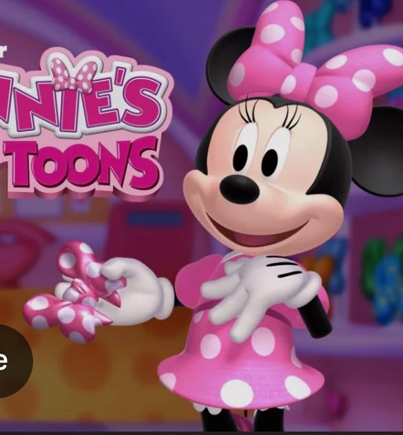 A screen shot of Minnie Mouse from the show “Minnie’s Bow Toon”

She’s is a pink dress that is fitted around the waist and hips and then flares before the knees.