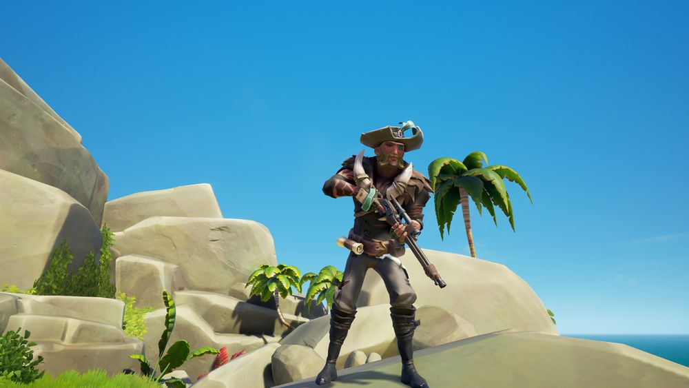 A Sea of Thieves pirate standing, leaning forward, aiming a rifle, on top of a high rock. Wearing a feathered grey cap, a brown coat with boar tusks and fur near the neck, hand wraps with a lucky card stuck inside, dark pants accented with a slice of blue shark skin near the belt, and black boots.