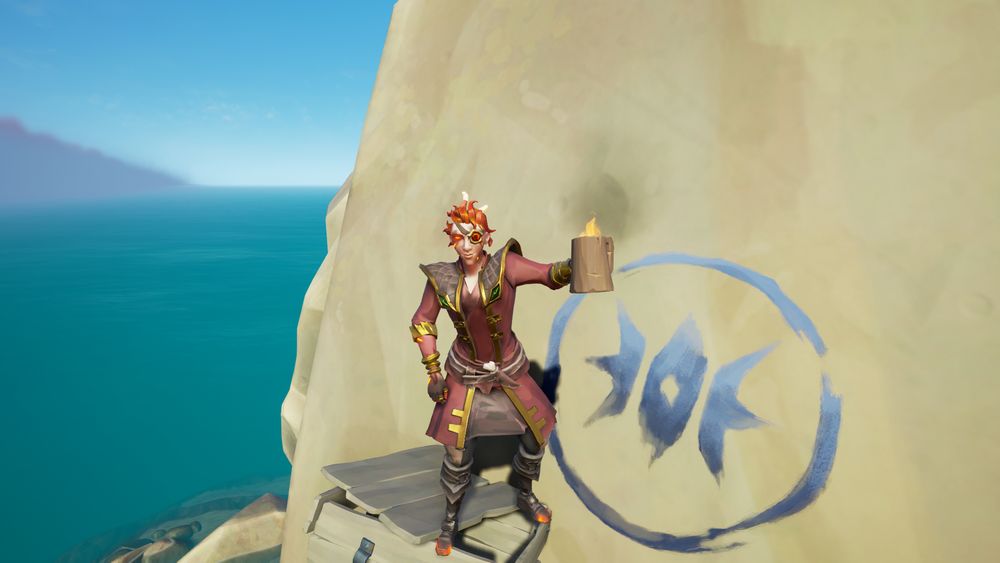 A Sea of Thieves pirate standing on a tall rock with fiery red hair, red eyes, red leathers with brown accents and gold trim, and boots with glowing red metal holds a tankard that holds a flame