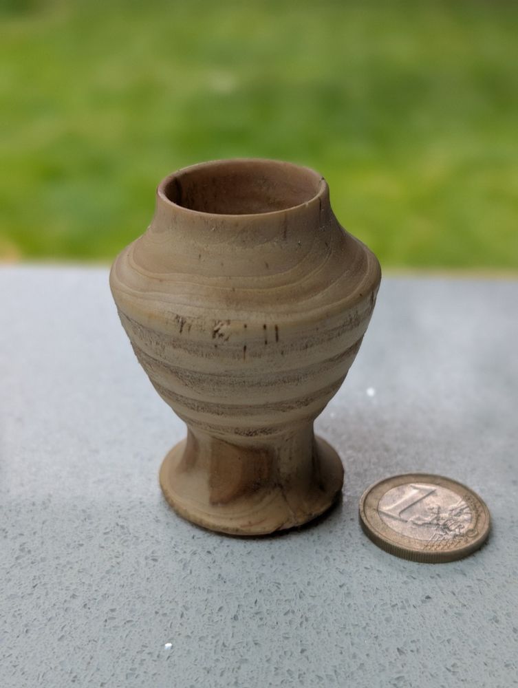 A tiny woodturned practice pot
