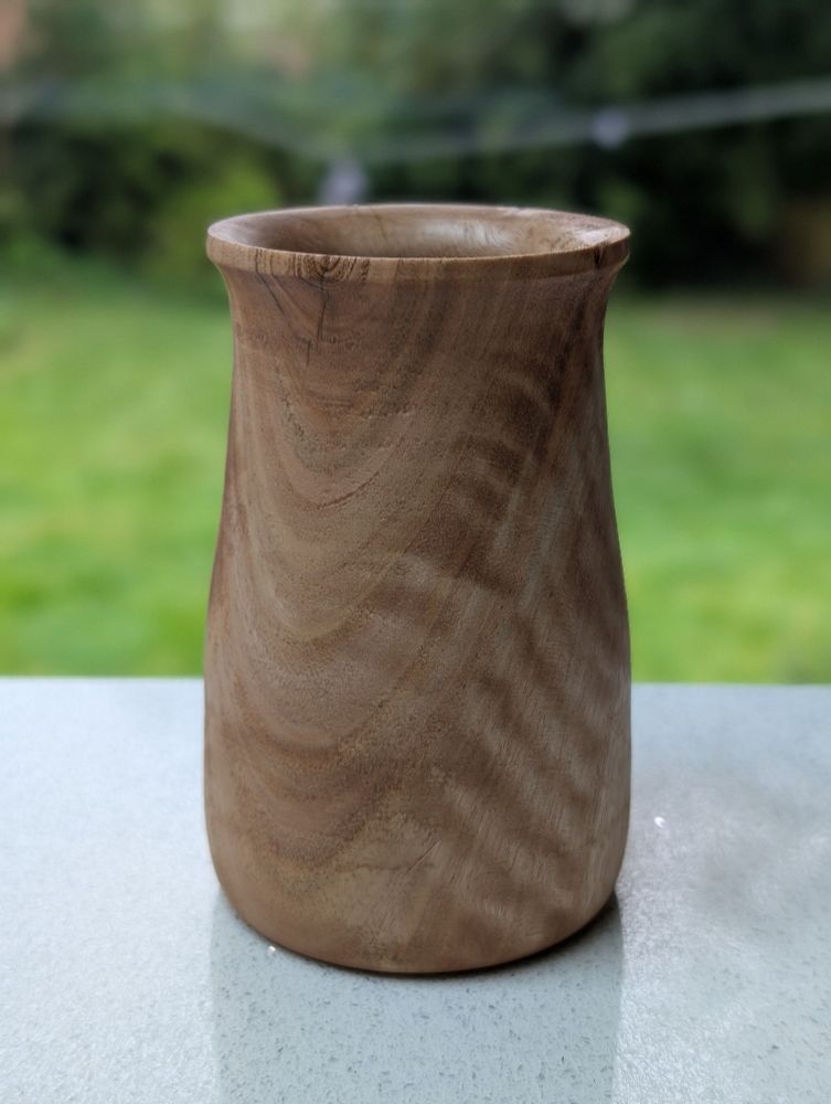A small ash vase with fantastic patterning
