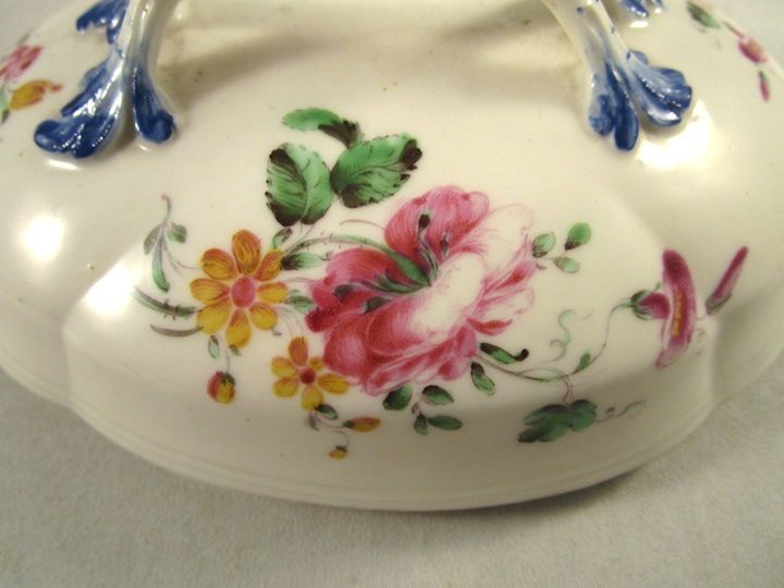 Nicely-painted flowers, more lively decoration than you usually see on Mennecy wares.