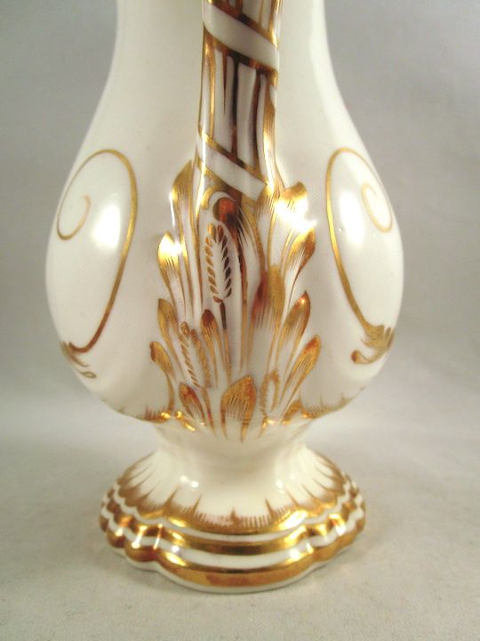 Wheat shafts snuck in amidst the gilding where the handle attaches to the base.