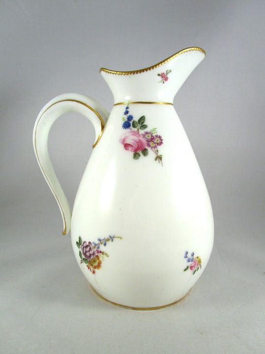 7 1/2” (19 cm) high, 5 1/2” (14 cm) in diameter.

Usually intended for use as a water pitcher during the toilette, and sometimes including a matching oval basin, these jugs were manufactured in four sizes and were introduced by 1752.