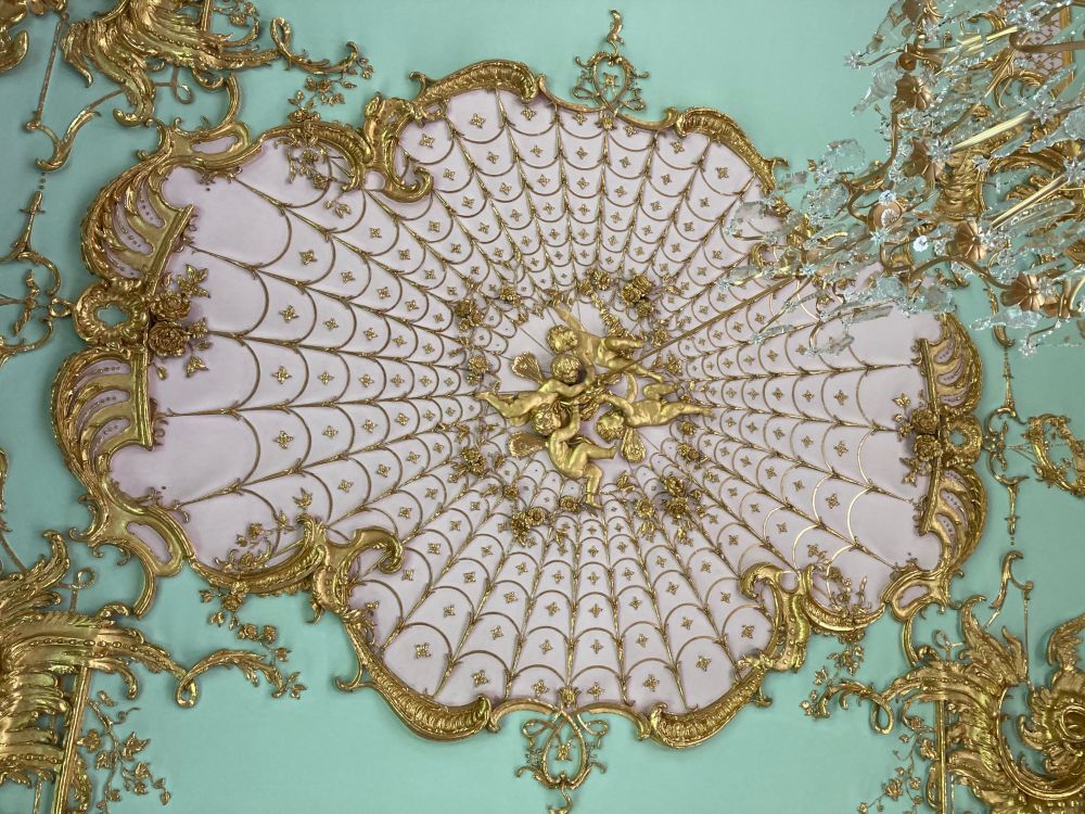 Probably not the intention, but I see putti stuck in a spider's web. 