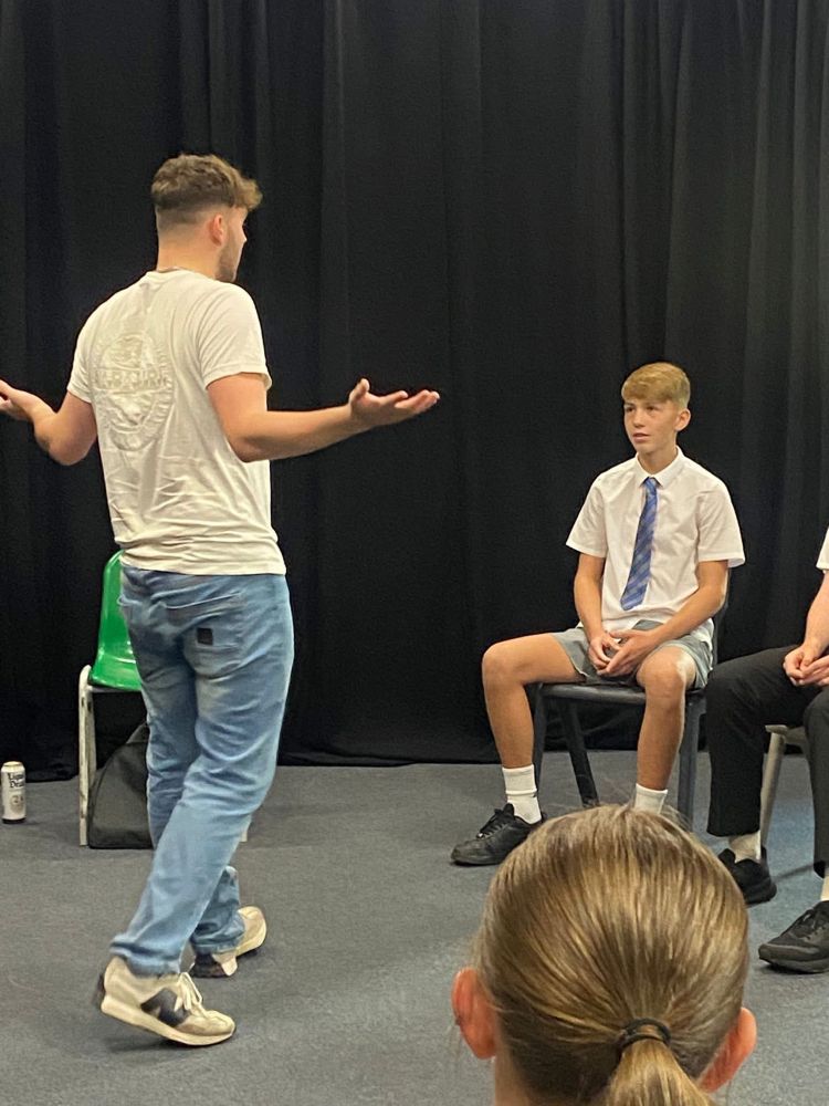 The actor performs to an audience member