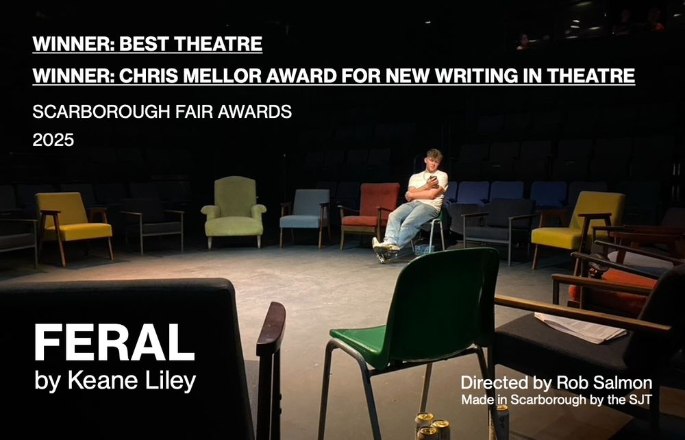 A young actor sits in a circle of chairs, scrolling through his phone. 