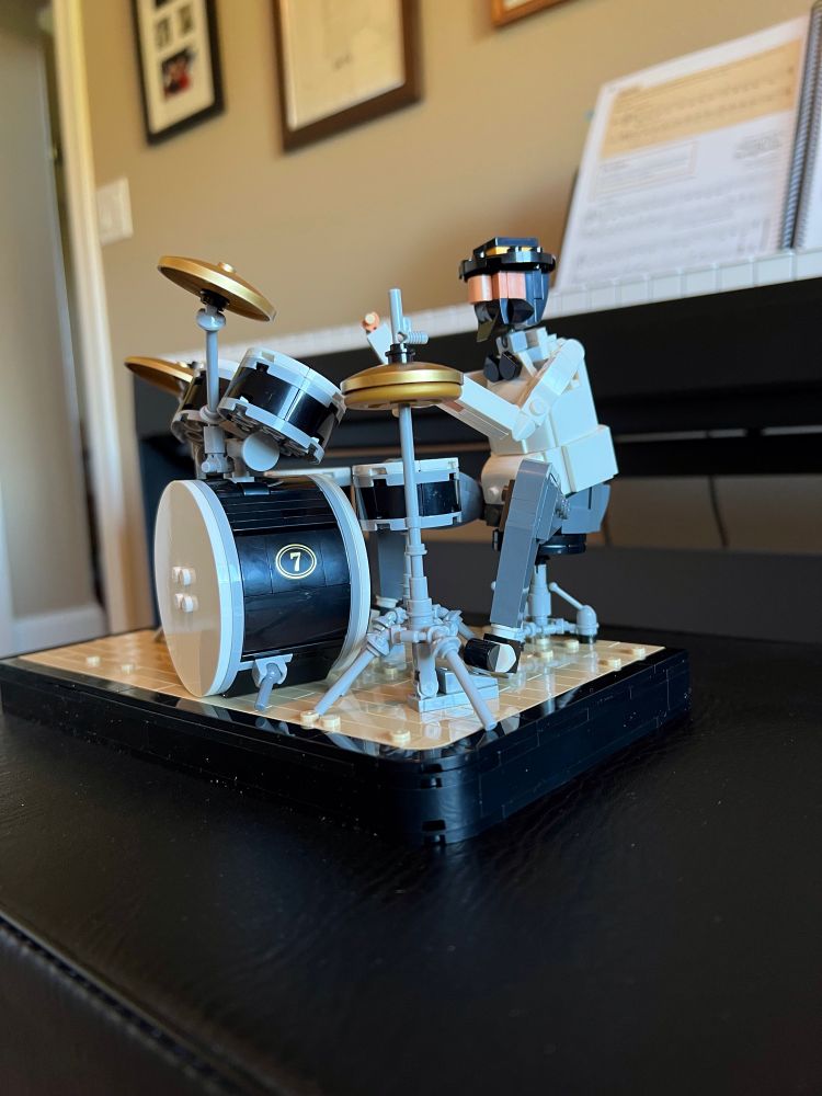 Side view of Lego drummer and drum set