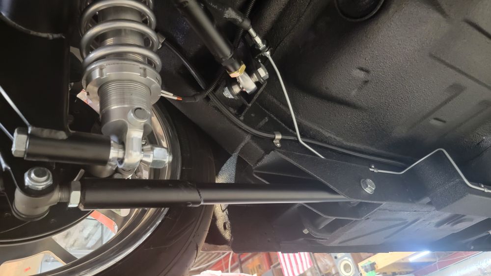 Lower links were shortened, sleeved with a fish-mouthed piece. Upper links with new heim joints installed. Terrible pic.