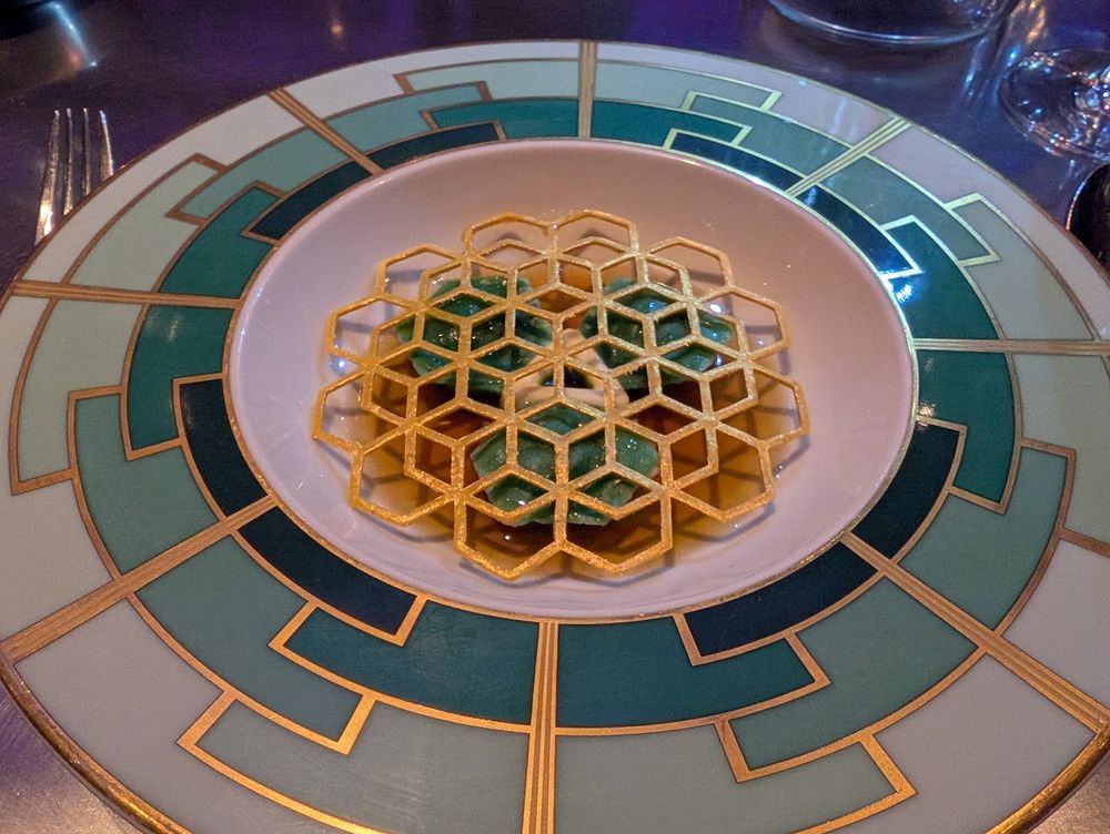 Cosmic geometry: duck pelmeni, sour cream, dill