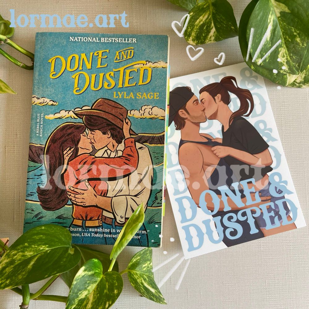 An art print of Emmy and Luke wedged between the pages of a copy of Done and Dusted by Lyla Sage. 