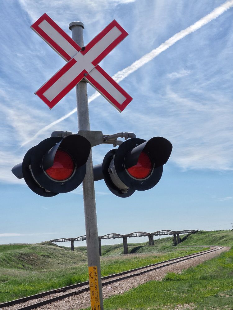 Rail crossing, a bridge and chemtrails
