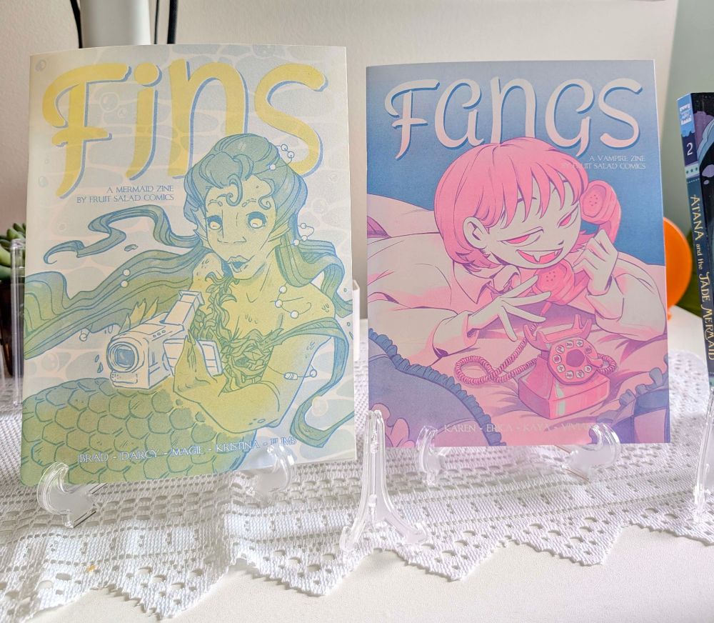 Photo of riso printed comic anthologies Fins and Fangs