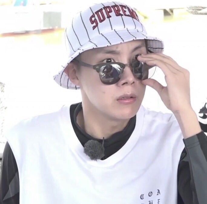 Screencap of JHS dramatically gripping his sunglasses.