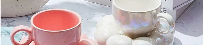 crop of a photo of 2 cups with a stack of books in the back