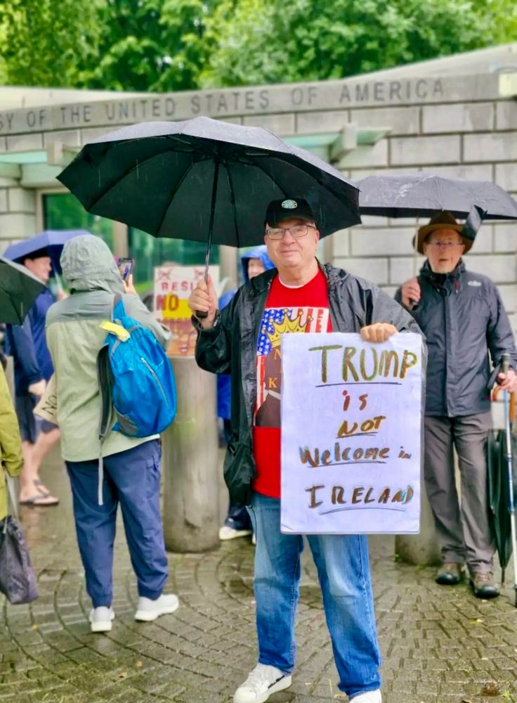 Man holding sign that reads: Trump is Not Welcome in Ireland in front of US Embassy, Dublin 