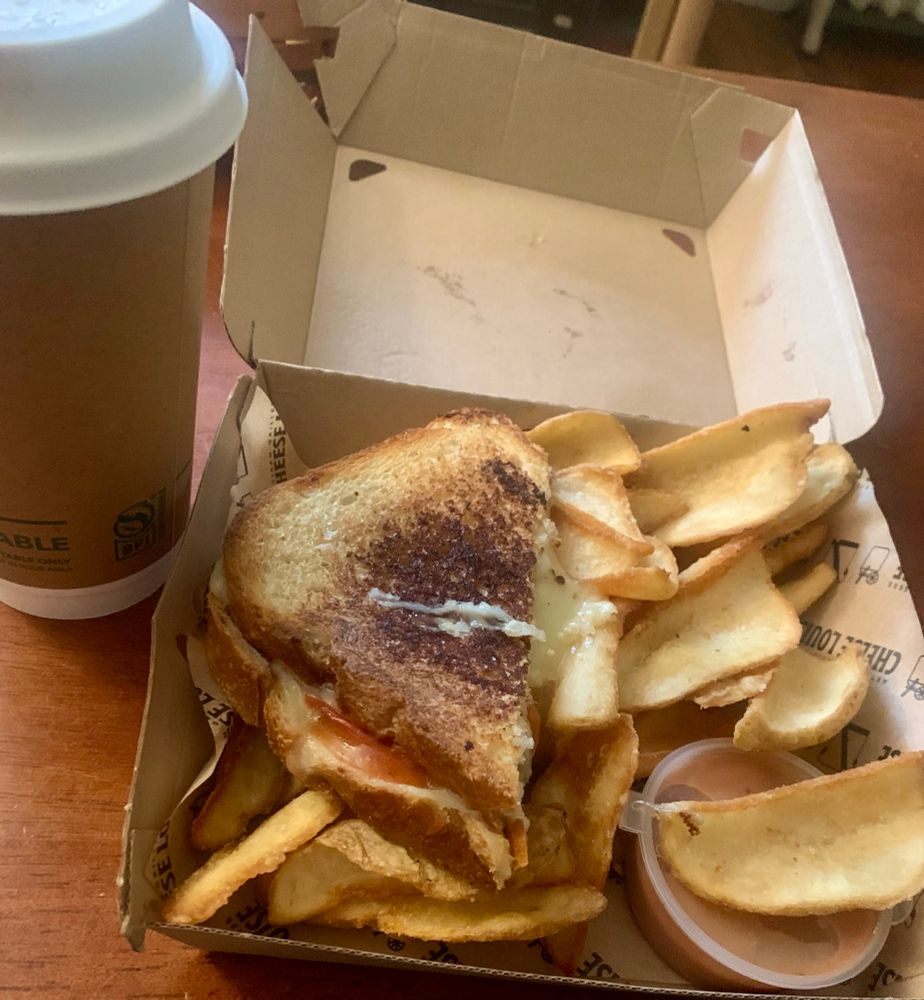 Hot chocolate and a pizza grilled cheese with fries and secret sauce
