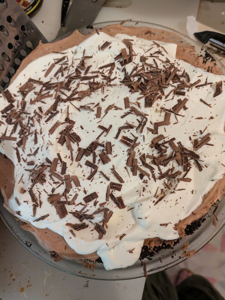 A top-down view of a homemade chocolate silk pie 