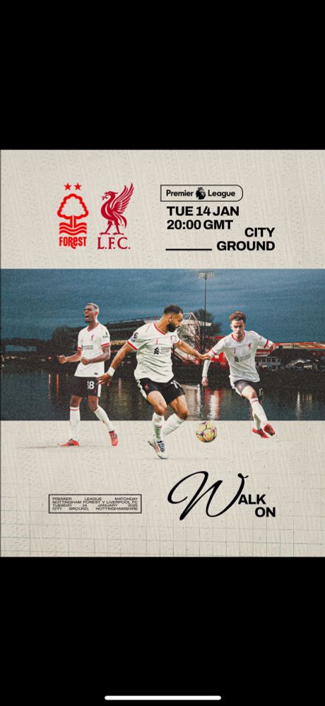 Picture of three Liverpool players in their away white kit. 