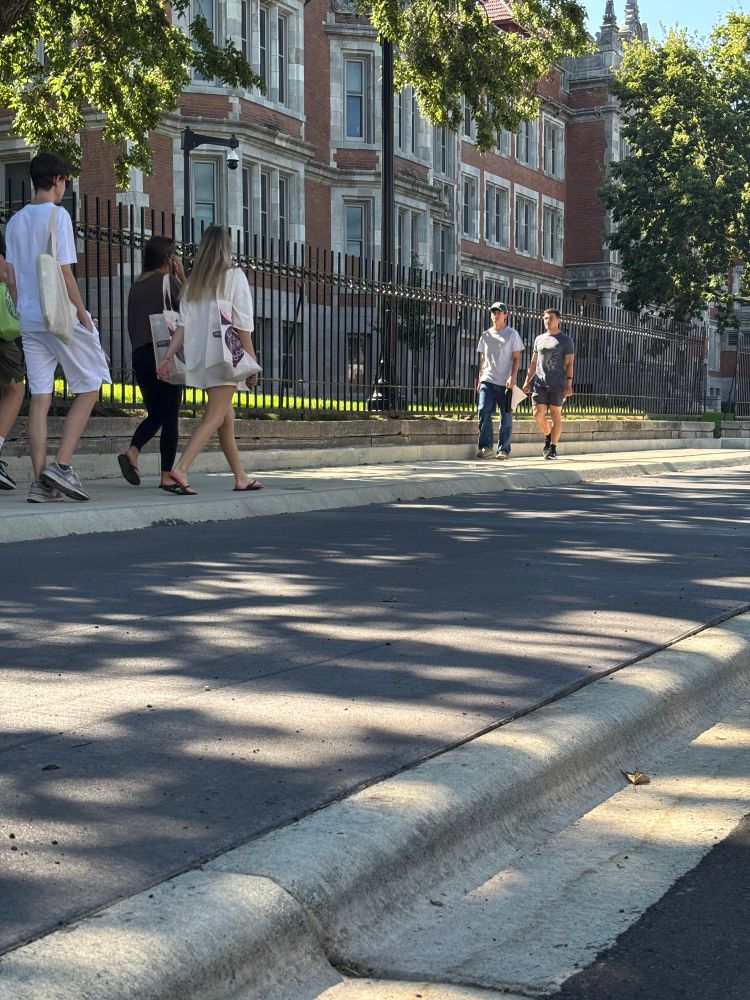 Same shot, zoomed out further, with pedestrians on the sidewalk 