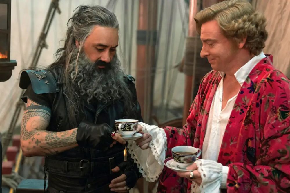 A shot of Our Flag Means Death where the two captains affectionately share an afternoon tea