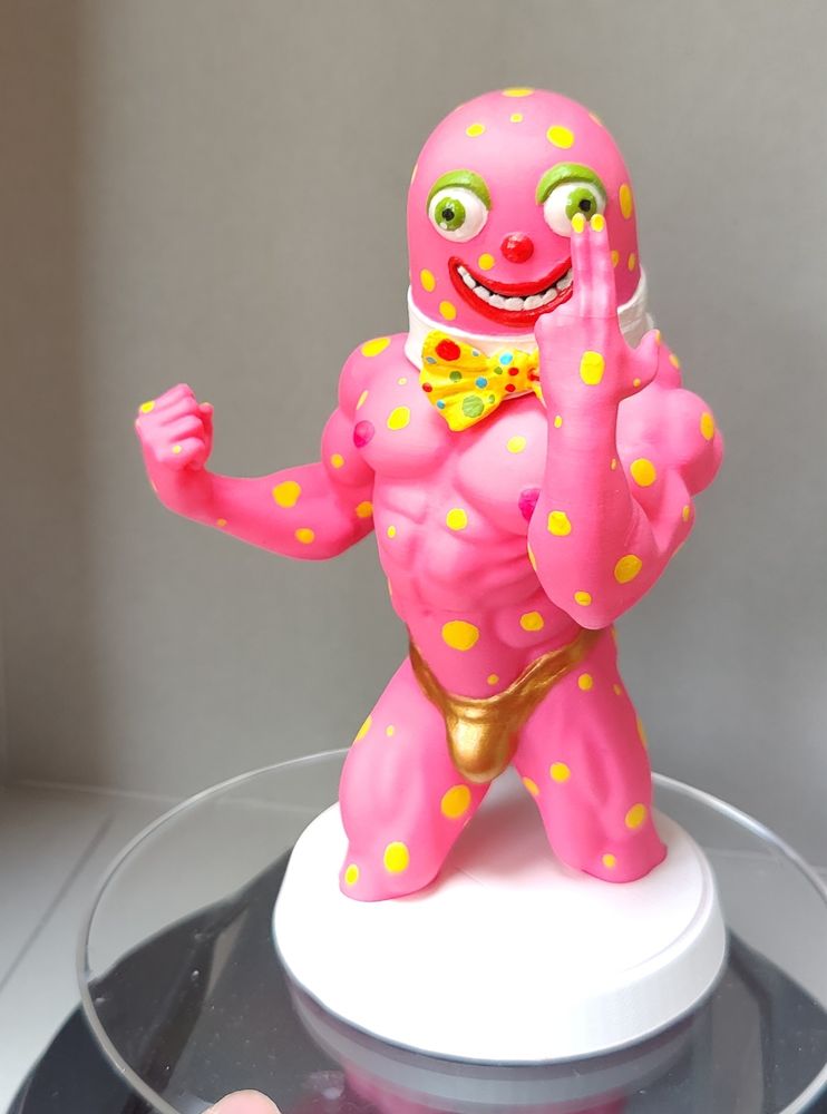 Mr Blobby painted sculpt. He is pink, has big beautiful eyes and a gold swimsuit on.