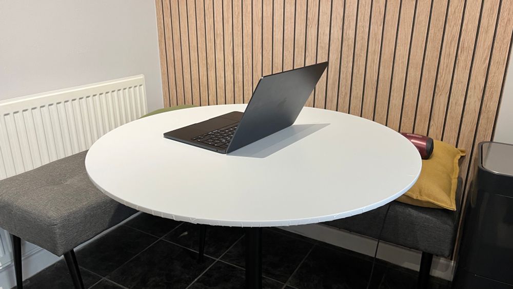 After: kitchen table top wrapped with matt white vinyl. 