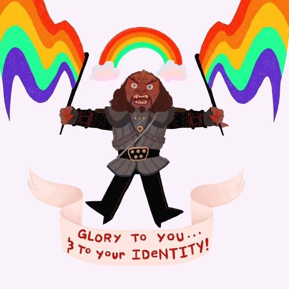 A meme of a cartoon Gowron (Klingon from Star Trek DS9) jumping up while holding a Pride flag in each hand with a rainbow over his head and "Glory to you... & to your identity!" is written below him on an ivory colored banner.