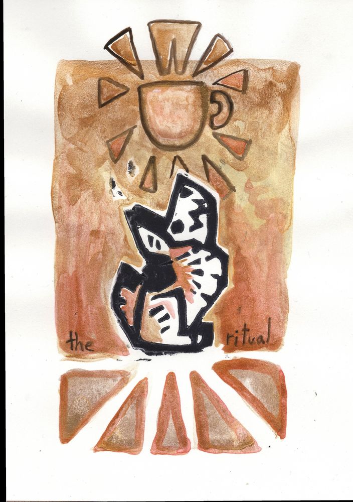 A stamp of a skull-faced coyote stamp. This is a linocut print made with golden paint and coffee paint. It says “The ritual” and the coyote is staring up at a golden mug. 