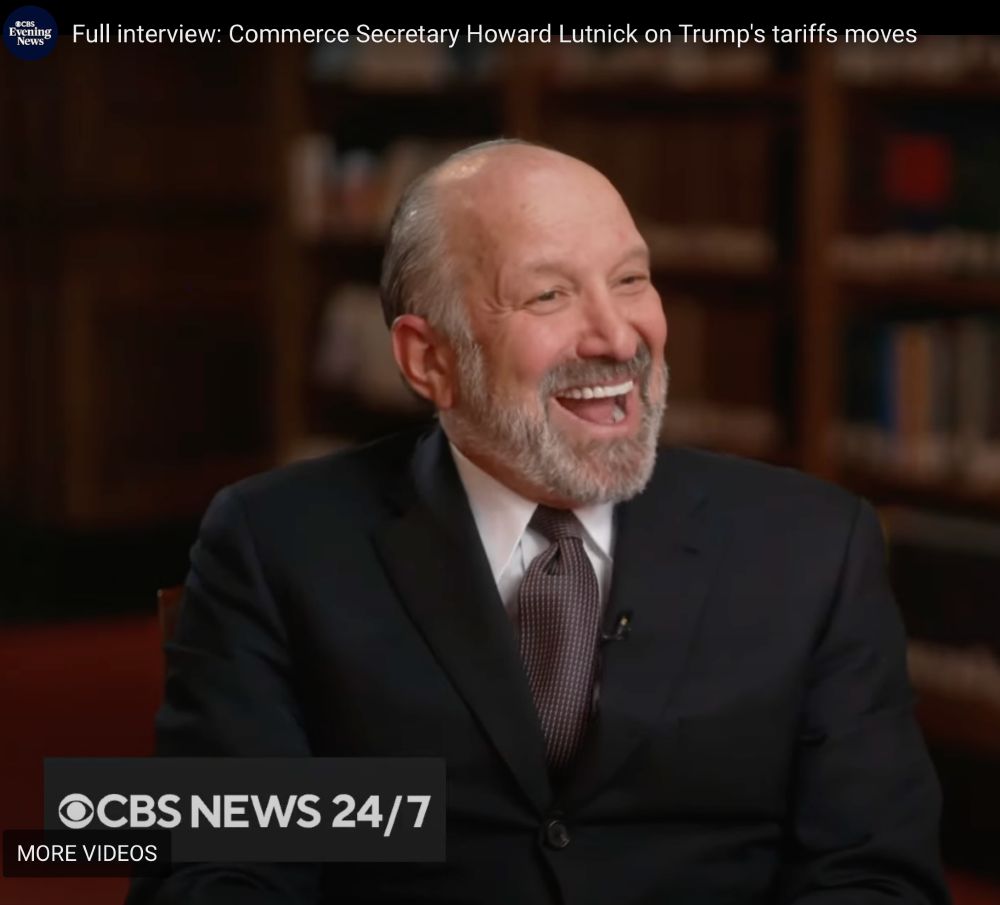 Still of Lutnick laughing on CBS Evening News