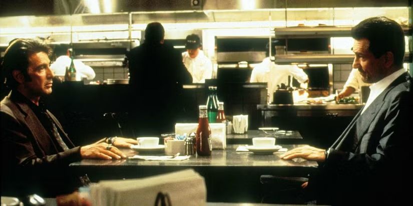 A photograph of Al Pacino and Robert De Niro's famous diner scene in Heat 