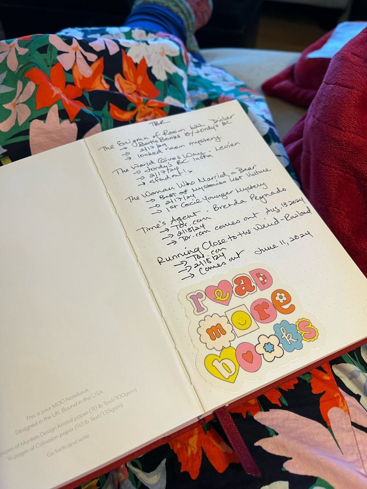 Reading sticker in a notebook that says “read more books”