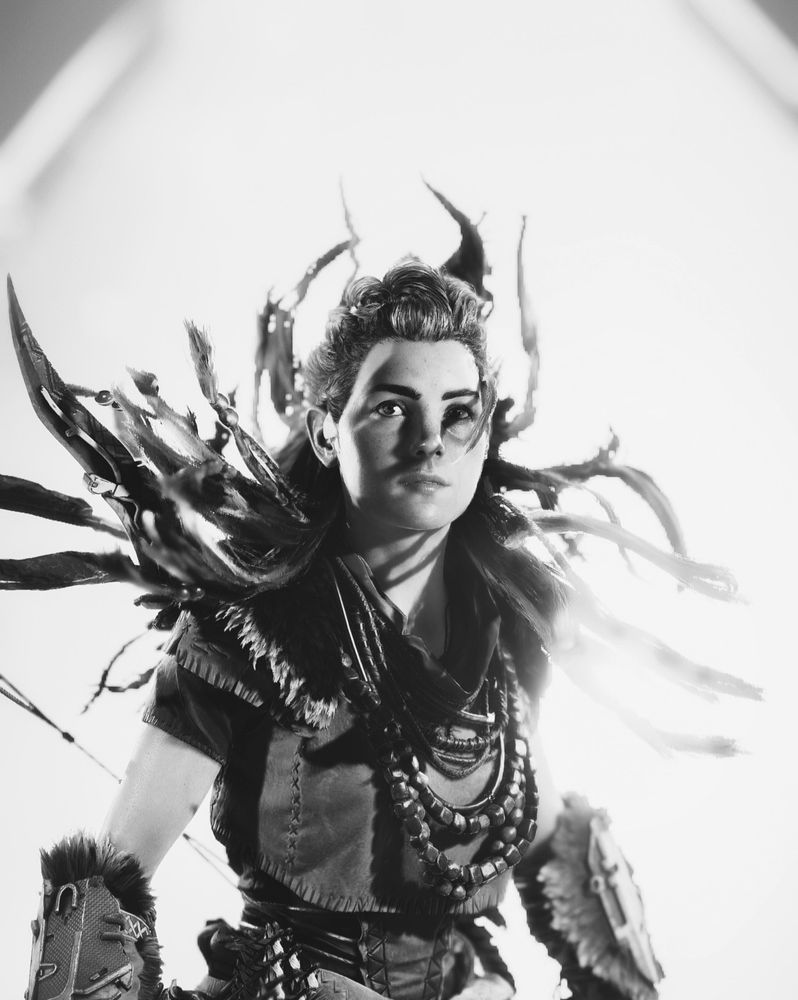 Aloy from Horizon Forbidden West with her hair moving up with a white background in b&w
