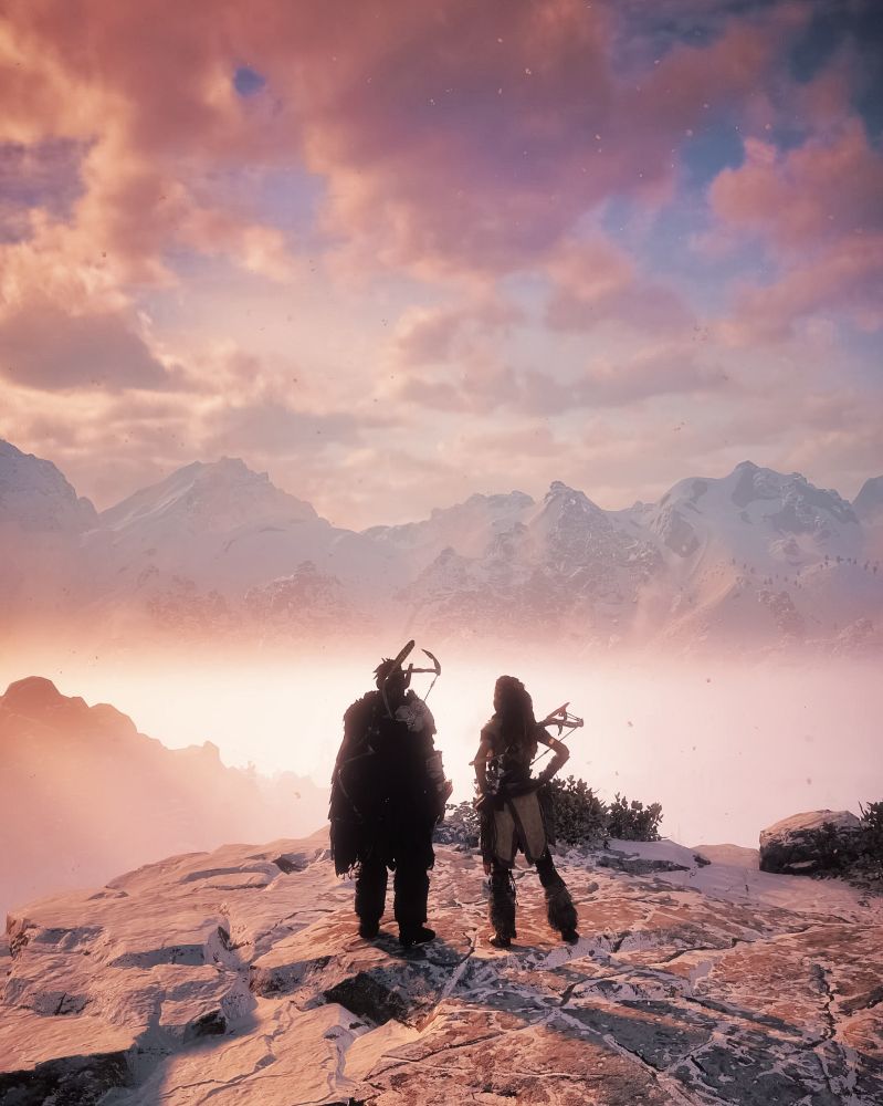 Rost and aloy facing the mountains 
