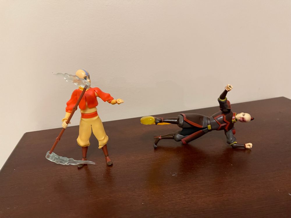 Aang and Zuko 4’ action figures. Zuko on his side doing a sweeping fire kick.
