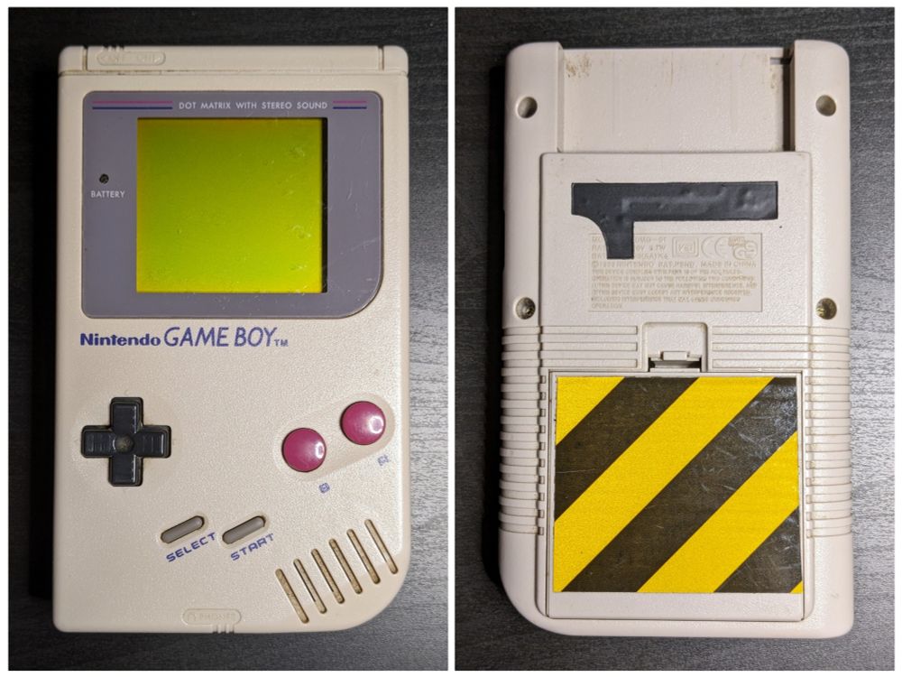 Two-panel photo showing the front & back of a Nintendo Game Boy, in original grey shell, on which a diagonal black-and-yellow "caution"-style decal has been affixed to the battery compartment cover, and a numeral "1" decal just below the cartridge slot.