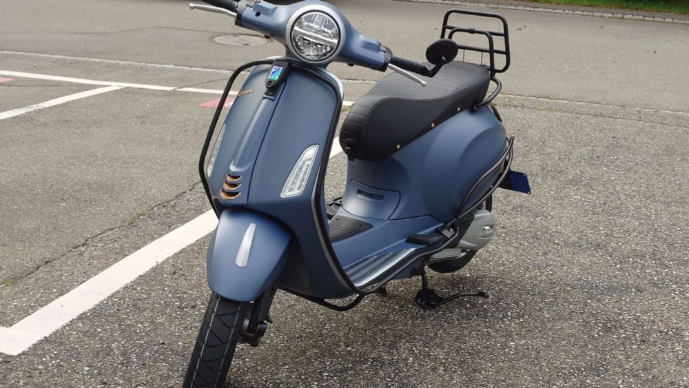 Same scooter as previous picture. Parked outside.