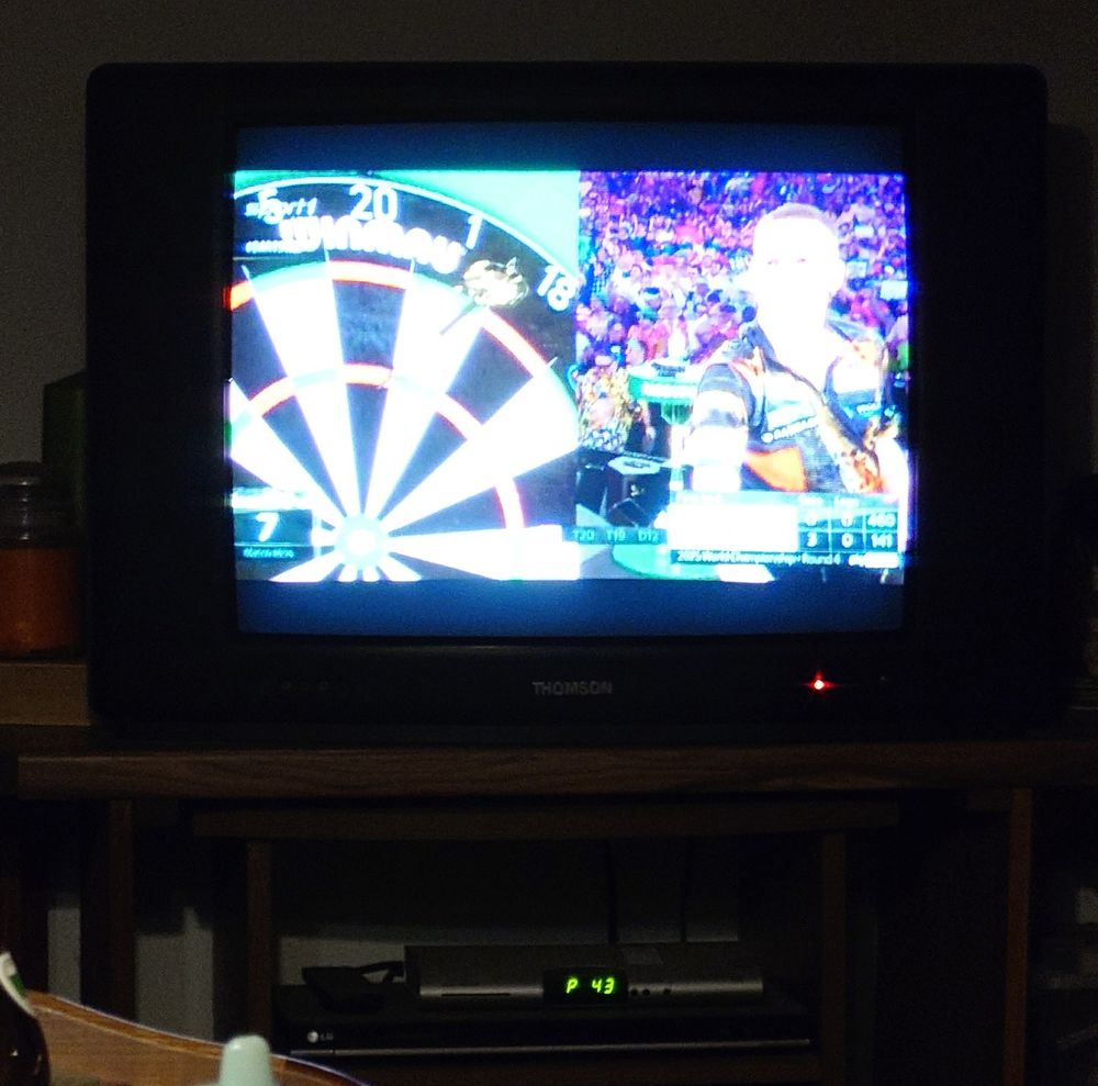 a CRT showing current (2024) programming on it